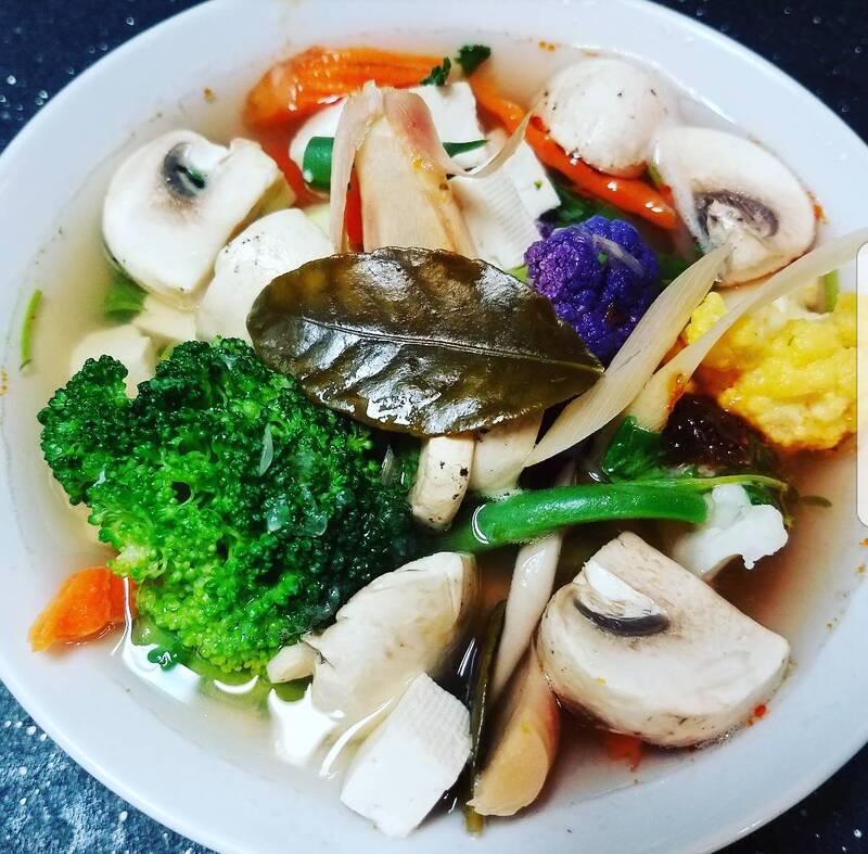 An elegantly plated noodle dish from the Thai Orchid Cuisine menu.